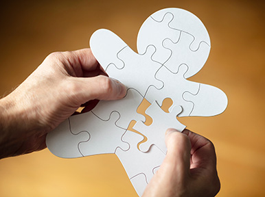 Preventative Dentistry is just part of whole body health Hands assembling puzzle pieces forming a tooth shape, representing restorative dentistry and complete smile solutions